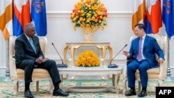 FILE - U.S. Defense Secretary Lloyd Austin, left, listens as Cambodia's Prime Minister Hun Manet speaks during a meeting at the Peace Palace in Phnom Penh on June 4, 2024.