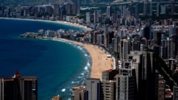 Apartment towers sit along the promenade of the closed Levante Beach in Benidorm, June 1, 2020. Spain has begun a gradual, staged transition out of a national lockdown put in place to fight the spread of the novel coronavirus.