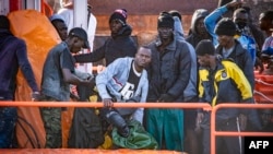 Migrants disembark after being rescued at sea by a Spanish search and rescue vessel at La Restinga port on the Canary island of El Hierro on Dec. 3, 2024.