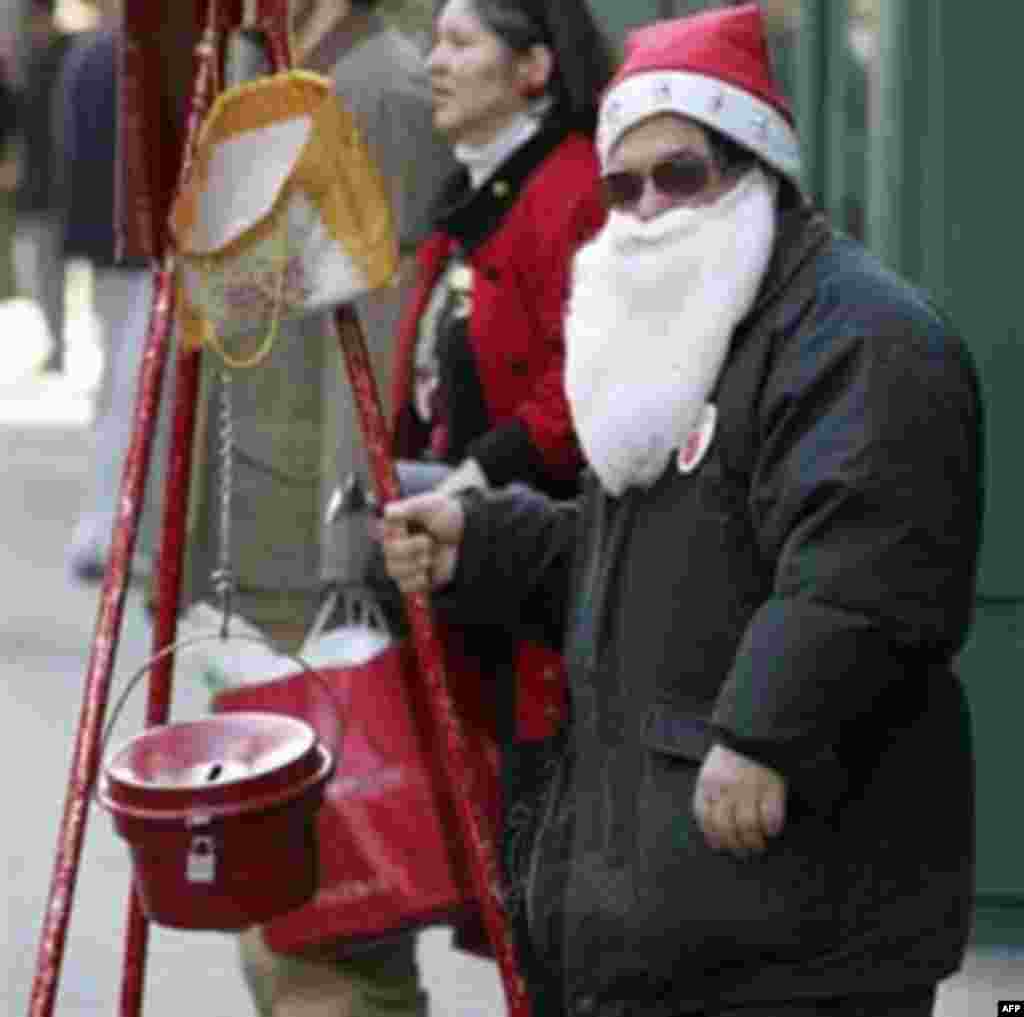 Edward Atkins of Revere Mass., rings a Salvation Army bell at Downtown Crossing in Boston