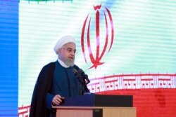 FILE - In this photo released by the official website of the office of the Iranian Presidency, President Hassan Rouhani speaks in a ceremony in Tehran, Iran, Aug. 27, 2019.