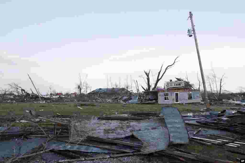 Residents of Marysville, Indiana, survey the tornado damage to their homes, March 2, 2012. (AP)