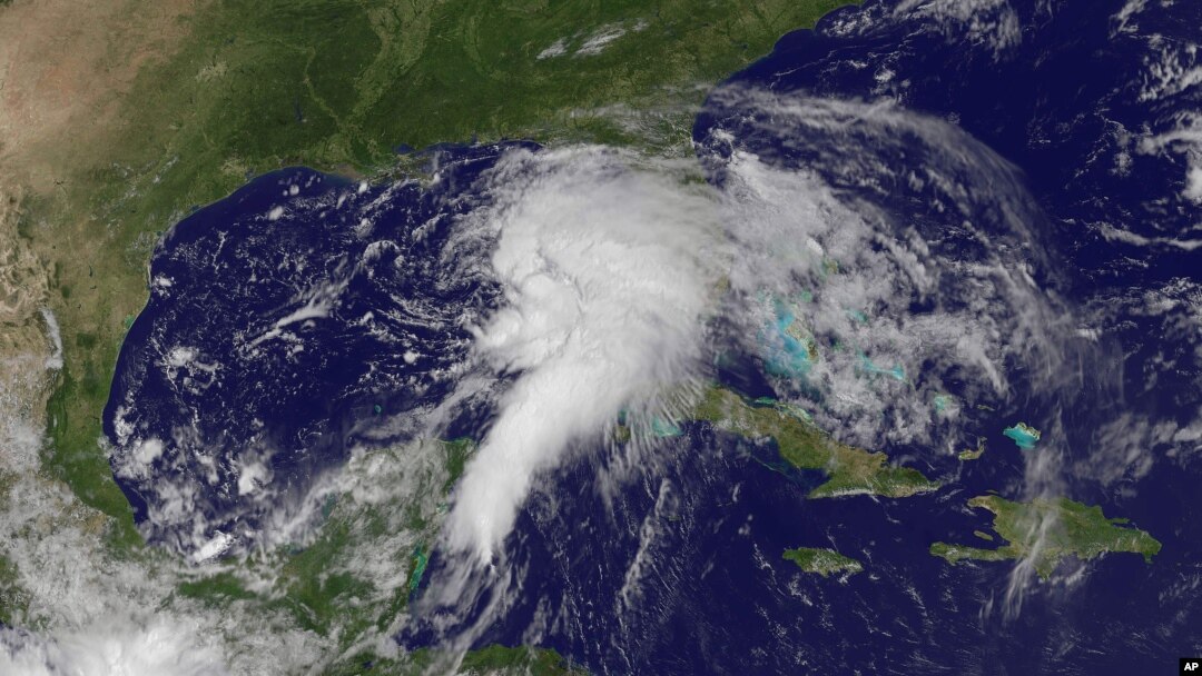 This NOAA satellite image shows shower and thunderstorm activity developing around an area of low pressure spinning in the Gulf of Mexico, June 23, 2012.