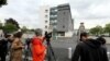 Journalists stand in front of the Sebastopol hospital in Reims, eastern France, on the day Vincent Lambert, a quadriplegic man who has been in a vegetative state for the last decade has died, on July 11, 2019. 