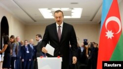 Azeri President Ilham Aliyev casts his vote in the presidential election at a polling station in Baku October 9, 2013. Aliyev appears certain to extend his rule in the oil-producing former Soviet republic for a third straight term in an election on Wednes