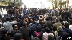 Protesters attend a demonstration after authorities raised gasoline prices, in the northern city of Sari, Iran, Nov. 16, 2019.