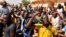 People hold a protest following an attack on security forces that killed 53 people, calling on Burkina Faso's President Roch Kabore to resign, in Ouagadougou, Burkina Faso, Nov. 16, 2021.
