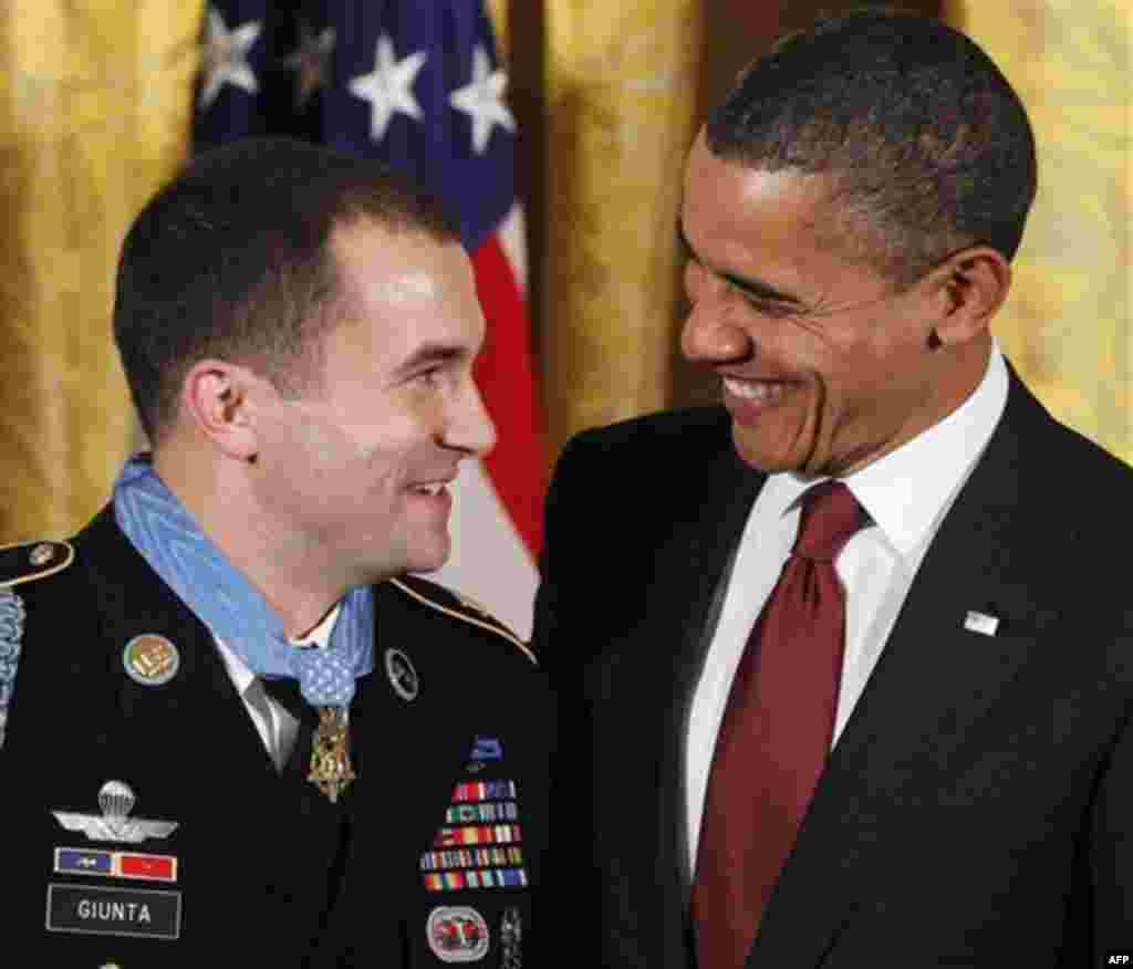 President Barack Obama smiles after he presented the Medal of Honor to Army Staff Sgt. Salvatore Giunta during a ceremony in the East Room of the White House in Washington, Tuesday, Nov. 16, 2010. Giunta, of Hiawatha, Iowa, is the first living veteran of 