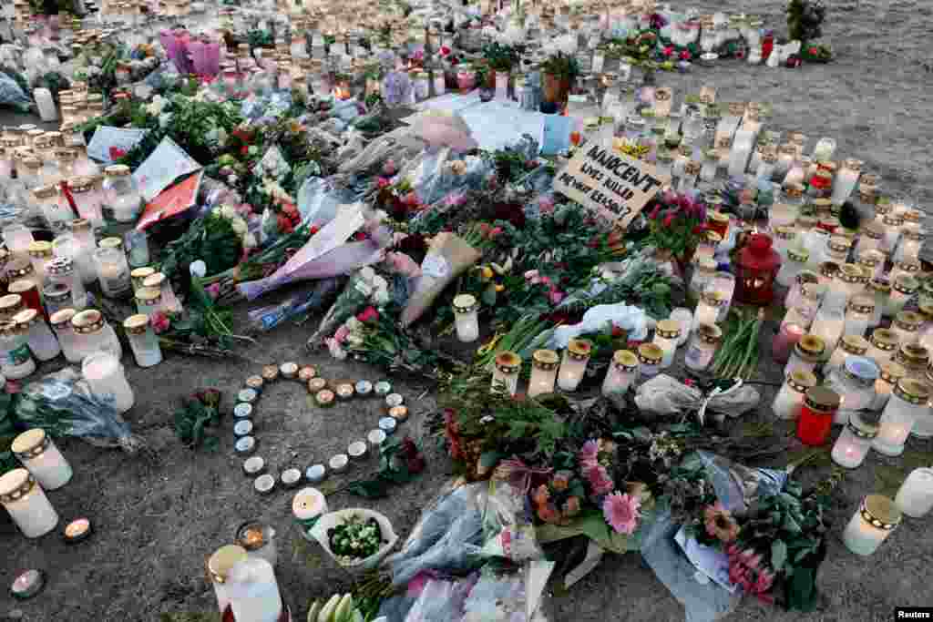 Candles and flowers are placed near the Risbergska school, following a deadly shooting attack at the adult education center, in Orebro, Sweden.