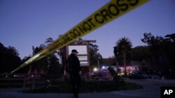 Police tape is placed near the scene of a shooting, Jan. 23, 2023, in Half Moon Bay, Calif.