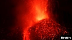 Italy's Mount Etna, Europe's tallest and most active volcano, spews lava as it erupts on the southern island of Sicily, Italy, February 27, 2017.