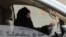 FILE - A woman drives a car on a highway in Riyadh, Saudi Arabia, as part of a campaign to defy Saudi Arabia's ban on women driving, March 29, 2014. Women's rights activists are among those being detained in Saudi Arabia. 