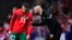 Morocco's coach Walid Regragui, right, talks to Bilal El Khannouss during the International friendly soccer match between Morocco and Peru at the Civitas Metropolitano stadium in Madrid, Spain, Tuesday, March 28, 2023. 