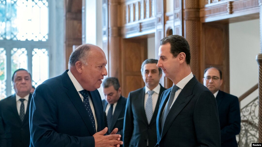 Syria's President Bashar al-Assad meets with Egypt's Foreign Minister Sameh Shoukry in Damascus