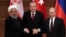 Presidents Hassan Rouhani of Iran, Recep Tayyip Erdogan of Turkey and Vladimir Putin of Russia hold a joint news conference after their meeting in Ankara, Turkey, April 4, 2018.