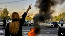 FILE - In this photo taken by an individual not employed by the Associated Press and obtained by the AP outside Iran, Iranians protests the death of 22-year-old Mahsa Amini after she was detained by the morality police, in Tehran, Oct. 1, 2022. 