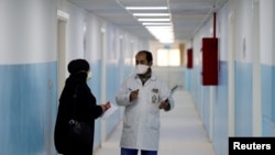 Members of the medical staff work at a new section specialized in receiving any person who may have been infected with coronavirus, at the Al-Bashir Governmental Hospital in Amman, Jan. 28, 2020.
