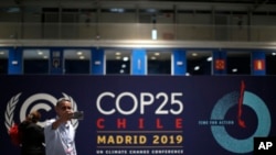 A participant takes a selfie ahead of the Climate Summit COP25 in Madrid, Nov. 29, 2019. The Climate Summit COP25 is scheduled for Dec. 2-13 in Madrid.