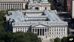FILE - The U.S. Treasury Department building, Sept. 18, 2019, in Washington. A new law forces "beneficial owners" behind shell companies to report their identities to Treasury's Financial Crimes Enforcement Network.