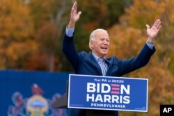 Democratic presidential candidate former Vice President Joe Biden speaks at a drive-in campaign stop at Bucks County Community College in Bristol, Pa., Oct. 24, 2020.