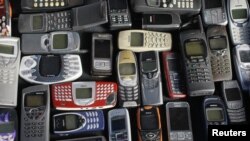 A collection of mobile phones. 