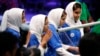 From left, Rodaba Noori, Somayeh Faruqi, Kawsar Roshan and Lida Azizi of Team Afghanistan encourage their robot during their final round of competition, at the FIRST Global Robotics Challenge, July 18, 2017, in Washington.