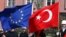 FILE - A Turkish guard of honor hold an EU flag and a Turkish flag in Ankara, Turkey, April 10, 2008.