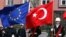 FILE - A Turkish guard of honor hold an EU flag and a Turkish flag in Ankara, Turkey, April 10, 2008.