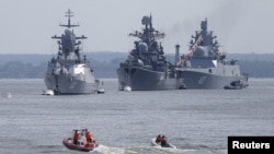 Russian warships are seen anchored in a bay of the Russian fleet base in Baltiysk in Russia's Kaliningrad region between Poland and the Baltic states, July 19, 2015.