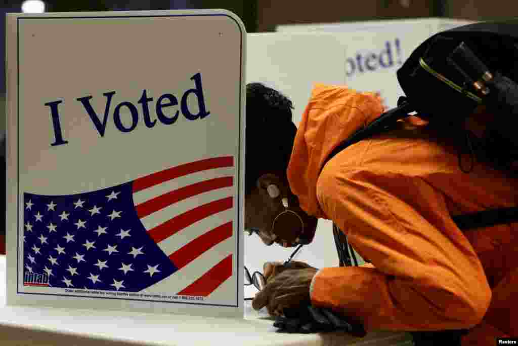 A person votes in the 2024 U.S. presidential election on Election Day, at Pittsburgh Manchester School in Pittsburgh, Pennsylvania, Nov. 5, 2024. 