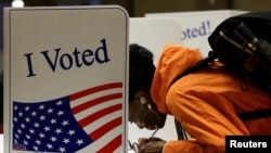 A person votes in the 2024 U.S. presidential election on Election Day, at Pittsburgh Manchester School in Pittsburgh, Pennsylvania, Nov. 5, 2024. 