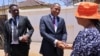 Botswana opposition leader Duma Boko shakes hands with a woman after his party UDC won the general election, outside his home in Gaborone, Botswana, Nov. 1, 2024