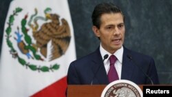 FILE -Mexico's President Enrique Pena Nieto talks during an official swearing-in ceremony for new ministers at the Los Pinos official residence in Mexico City, Aug. 27, 2015.