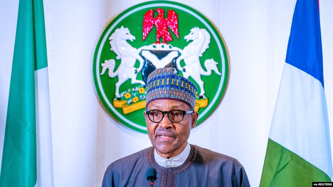FILE - Nigerian President Muhammadu Buhari addresses the nation on the coronavirus disease (COVID-19), in Abuja, March 29, 2020. (Nigeria presidency/handout)