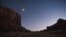 FILE - The moon glows over Indian Creek in the northern portion of Bears Ears National Monument, Utah, Oct. 29, 2017. 