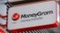FILE - A Moneygram logo is seen outside a bank in Vienna, Austria, June 28, 2016. 