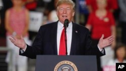 President Donald Trump speaks at a rally endorsing the Republican ticket in Erie, Pennsylvania, Oct. 10, 2018.