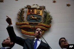 Opposition leader Juan Guaido speaks at the National Assembly in Caracas, Venezuela, Jan. 7, 2020. Guaidó and lawmakers who back him, pushed their way into the legislative building on Tuesday.