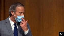 Sen. John Thune, R-S.D., arrives for a Senate Commerce Committee hearing on the pandemic's effect on the aviation industry, on Capitol Hill in Washington, May 6, 2020.