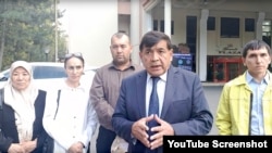 Khidirnazar Allakulov, leader of the unrecognized opposition party, addresses supporters following a meeting with OSCE/ODIHR in Tashkent, Uzbekistan, Oct. 1, 2024.