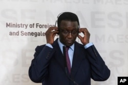 FILE - Senegal's Foreign Affairs minister Amadou Ba attends a press conference at the Presidential Palace, in Dakar, Senegal, February 16, 2020