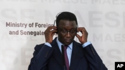 FILE - Senegal's Foreign Affairs minister Amadou Ba attends a press conference at the Presidential Palace, in Dakar, on February 16, 2020.