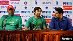 Afghanistan's cricket team captain Asghar Stanikzai (C), Afghanistan cricket team coach Phil Simmons (L) and Afghanistan's National Team Manager Shir Agha Hamkar address a news conference in Bengaluru, India, June 13, 2018.