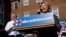 Democratic presidential candidate Hillary Clinton takes the stage for a rally with Virginia Governor Terry McAuliffe in Alexandria, Virginia, Oct. 23, 2015.