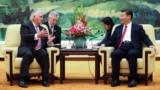 U.S. Secretary of State Rex Tillerson, left, meets with China's President Xi Jinping at the Great Hall of the People, Saturday, Sept. 30, 2017, in Beijing.