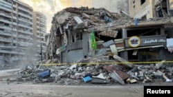 A damaged building is seen following Israeli strikes on Beirut's southern suburbs, November 13, 2024.