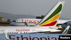 FILE - Ethiopian Airlines planes are seen at Bole International Airport in Addis Ababa, Ethiopia, April 7, 2020. 