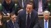 British Prime Minister David Cameron talks to lawmakers inside the House of Commons in London during a debate on launching airstrikes against Islamic State extremists inside Syria, Dec. 2, 2015. 