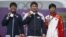 Silver medalist Japan's Takaharu Furukawa (L to R), gold medalist South Korea's Oh Jin Hyek and bronze medalist China's Dai Xiaoxiang pose during the victory ceremony for the men's individual archery event at the London 2012 Olympic Games at the Lord's C