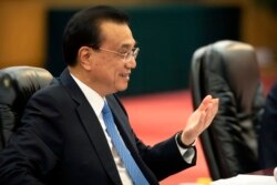 FILE - Chinese Premier Li Keqiang speaks during a meeting at the Great Hall of the People in Beijing, July 4, 2019.